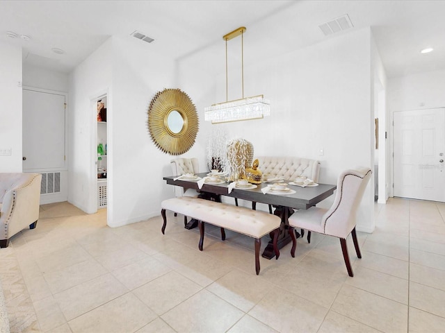 dining area with light tile patterned floors