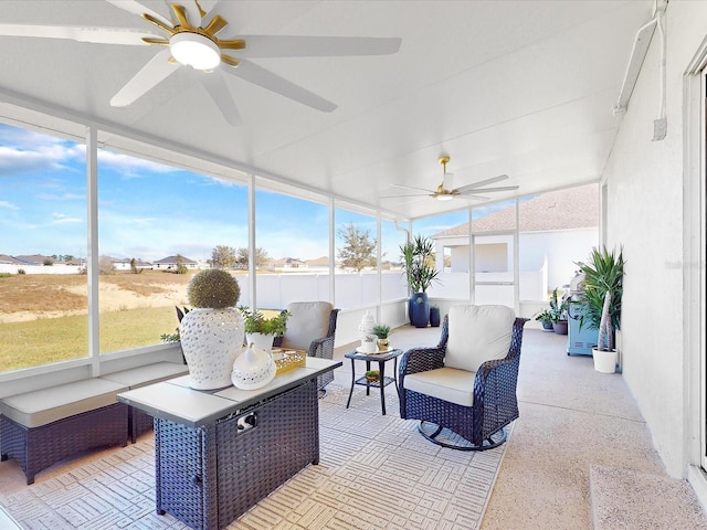 sunroom / solarium featuring ceiling fan