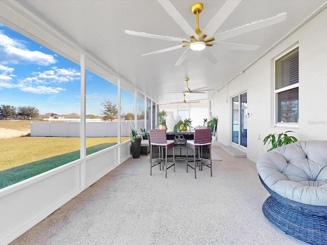 sunroom / solarium with ceiling fan