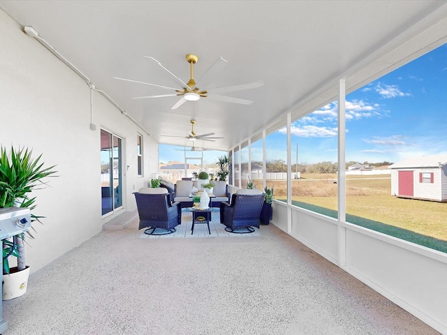 sunroom / solarium with ceiling fan