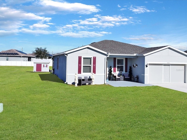 ranch-style home with a front lawn and a garage