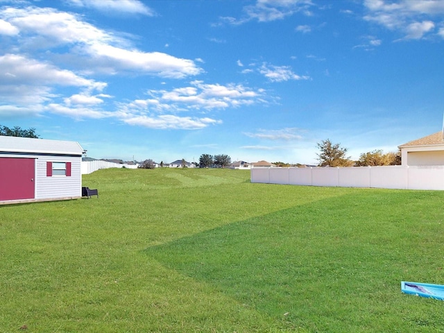 view of yard with a storage shed