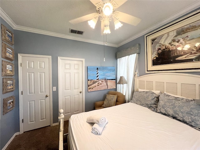 bedroom with visible vents, baseboards, a ceiling fan, ornamental molding, and carpet