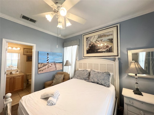 tiled bedroom featuring ceiling fan, ornamental molding, and connected bathroom