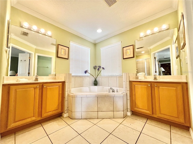 bathroom featuring a sink, crown molding, a garden tub, and a shower stall