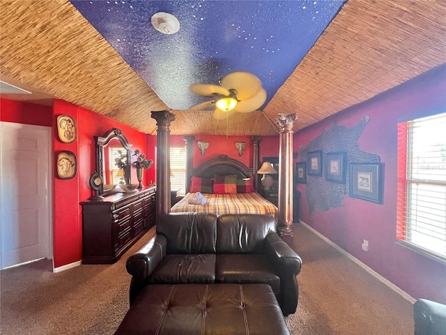 bedroom with carpet floors, vaulted ceiling, decorative columns, and ceiling fan