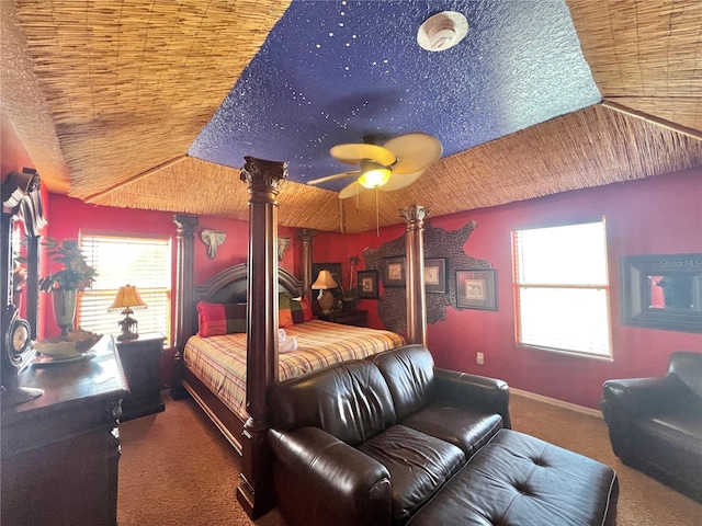 carpeted bedroom featuring wood ceiling, vaulted ceiling, decorative columns, and ceiling fan