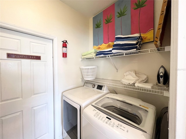 washroom featuring washer and dryer