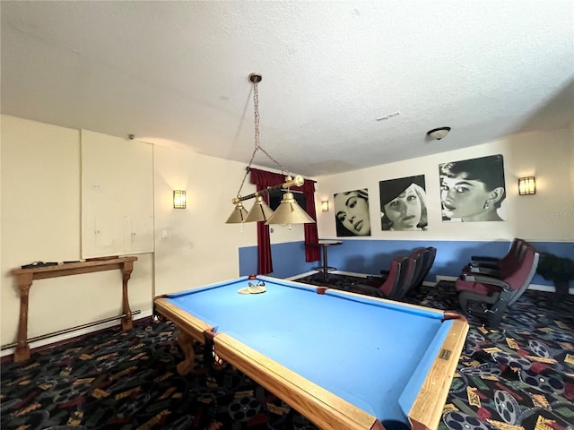 recreation room featuring a textured ceiling and pool table