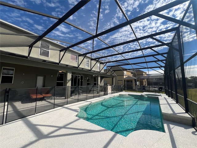 view of pool featuring a lanai and a patio