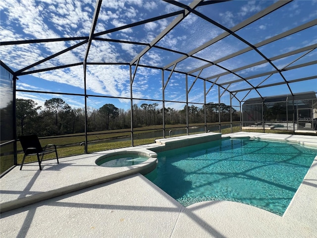 view of pool featuring a patio area, glass enclosure, and a pool with connected hot tub