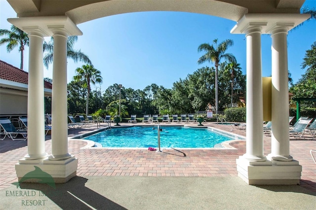 community pool with a patio area