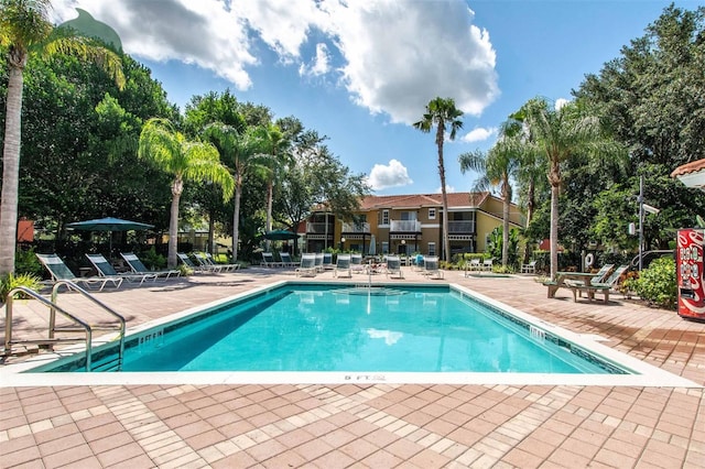 community pool featuring a patio area