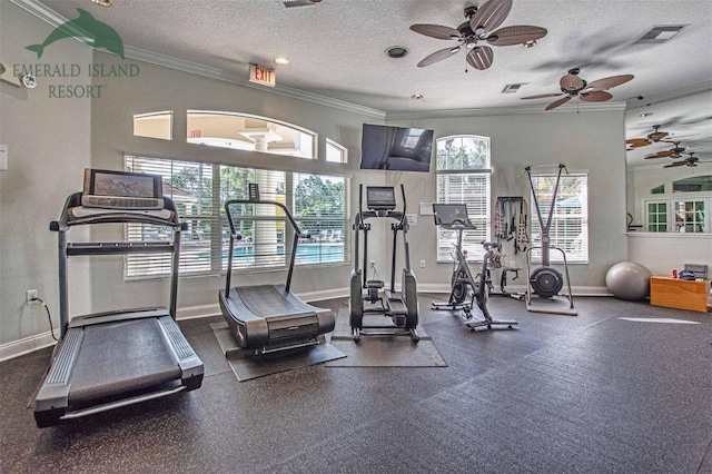 workout area with a textured ceiling, ornamental molding, visible vents, and baseboards