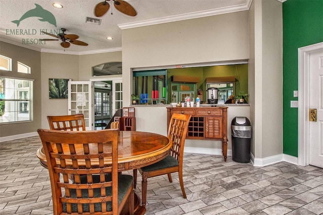 dining space featuring ornamental molding, visible vents, and baseboards