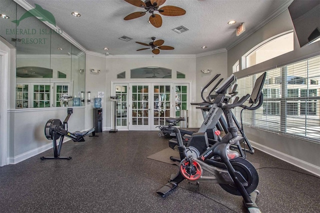 workout room featuring a textured ceiling, french doors, visible vents, and crown molding