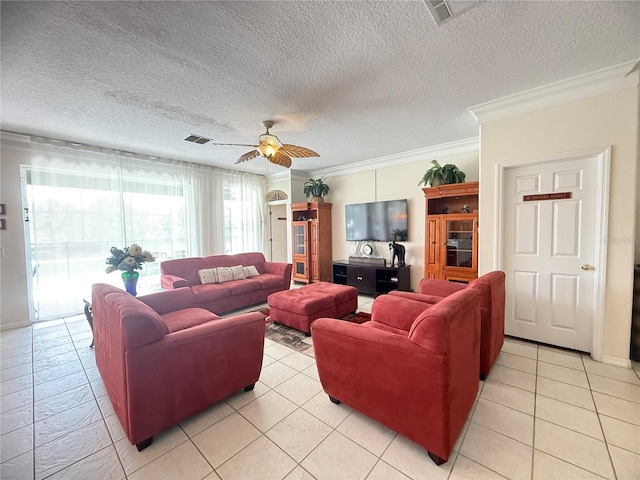8557 La Isla Dr, Kissimmee, FL 34747 - living area featuring a ceiling fan, ornamental molding, a textured ceiling, and light tile patterned floors