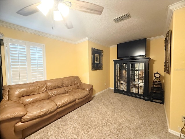 8557 La Isla Dr, Kissimmee, FL 34747 - living room featuring carpet flooring, a ceiling fan, crown molding, and baseboards