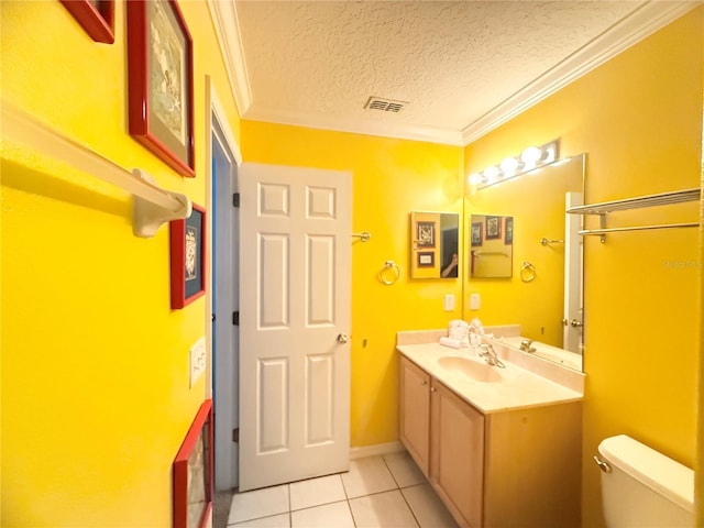 8557 La Isla Dr, Kissimmee, FL 34747 - bathroom featuring toilet, vanity, tile patterned flooring, a textured ceiling, and crown molding