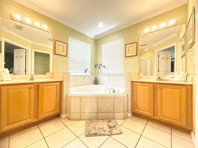 8557 La Isla Dr, Kissimmee, FL 34747 - bathroom featuring two vanities, a bath, ornamental molding, and tile patterned floors