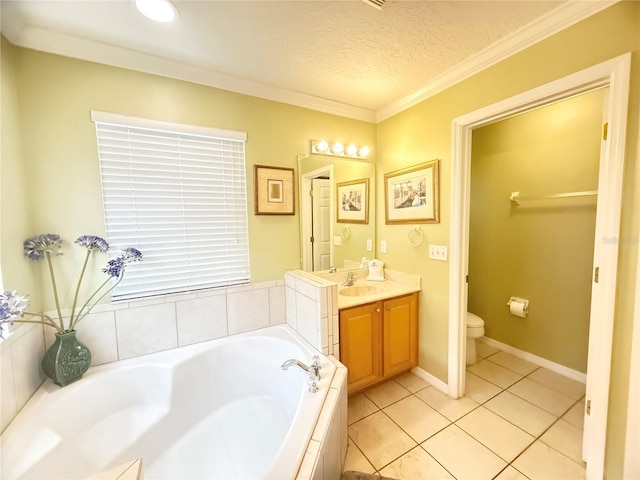 8557 La Isla Dr, Kissimmee, FL 34747 - bathroom featuring a garden tub, vanity, ornamental molding, toilet, and tile patterned flooring