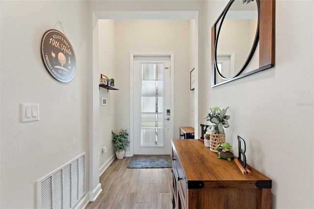 doorway with light hardwood / wood-style floors