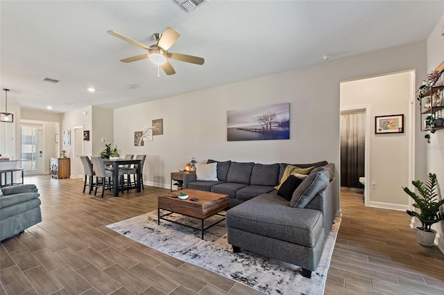 living room with ceiling fan