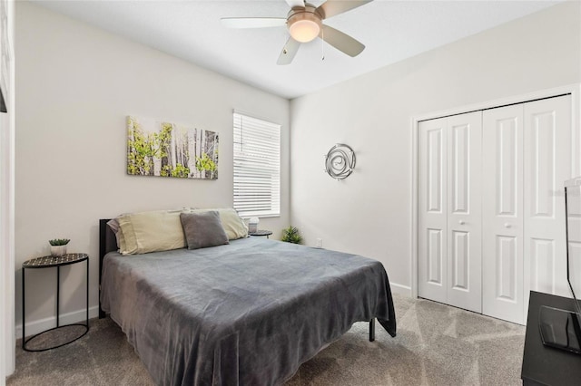 carpeted bedroom featuring ceiling fan and a closet