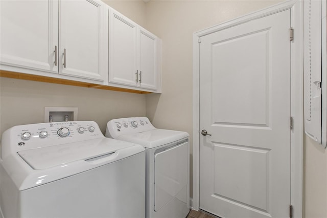 laundry room featuring cabinets and washing machine and clothes dryer