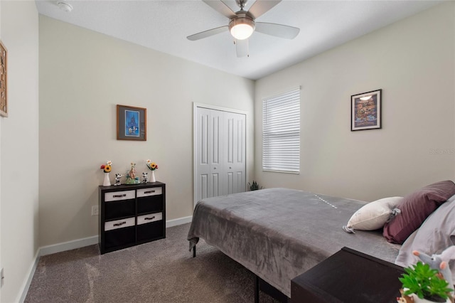 carpeted bedroom featuring ceiling fan and a closet