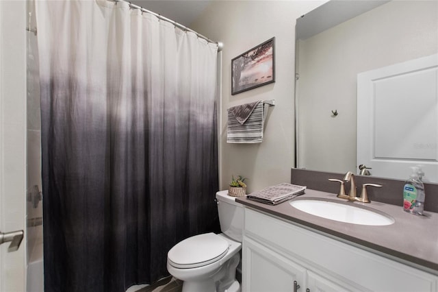 bathroom with toilet and vanity