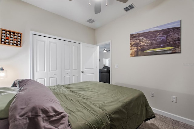 carpeted bedroom with ceiling fan and a closet