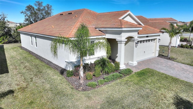 view of property exterior featuring a garage and a yard