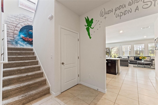 staircase with tile patterned floors