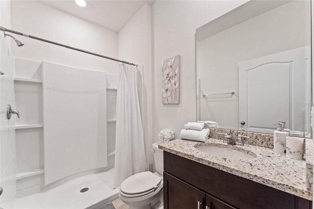 bathroom with vanity, a shower with curtain, and toilet