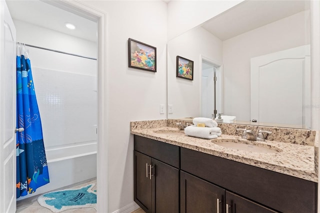 bathroom with vanity and shower / bath combo with shower curtain