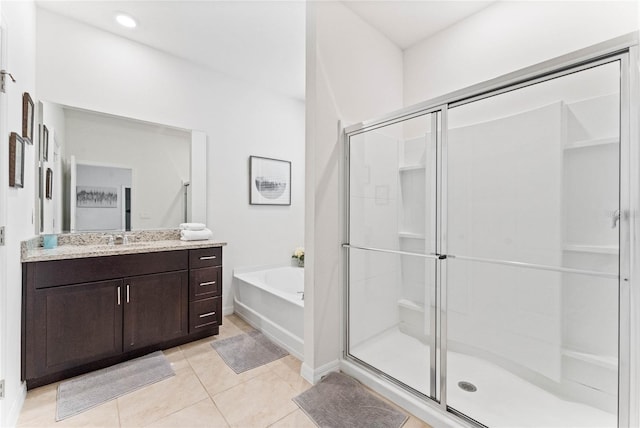 bathroom featuring tile patterned floors, independent shower and bath, and vanity