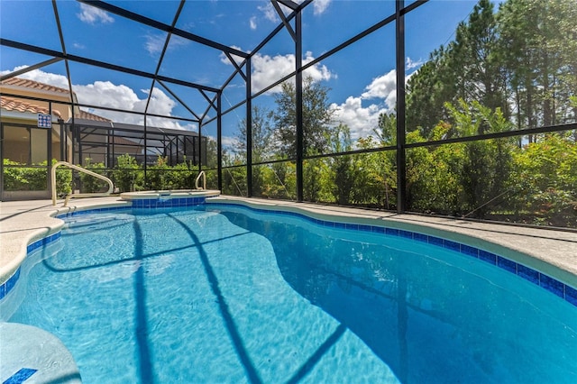 view of pool with a lanai