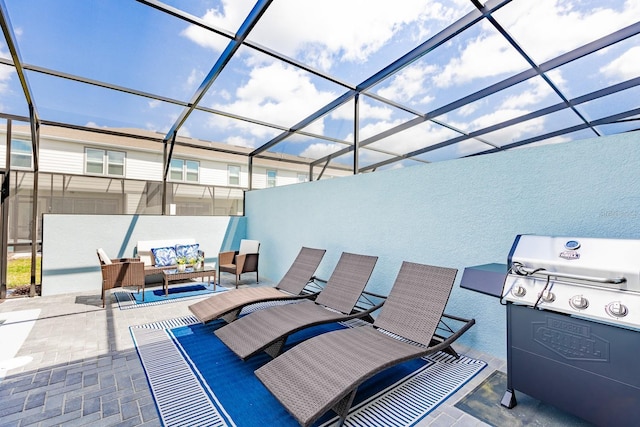 view of patio / terrace with an outdoor living space, area for grilling, and glass enclosure