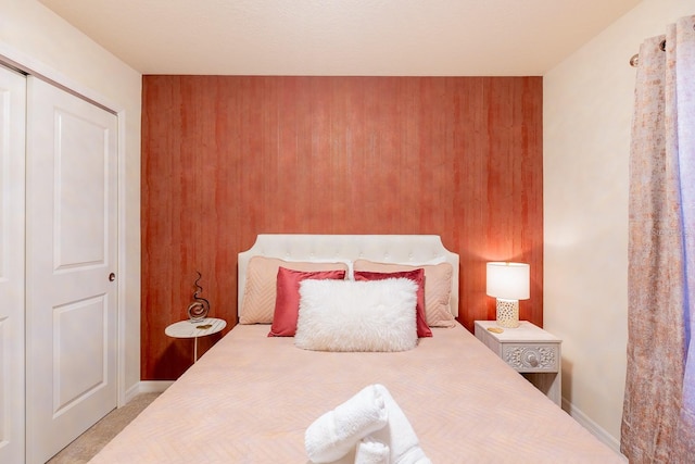 carpeted bedroom featuring a closet