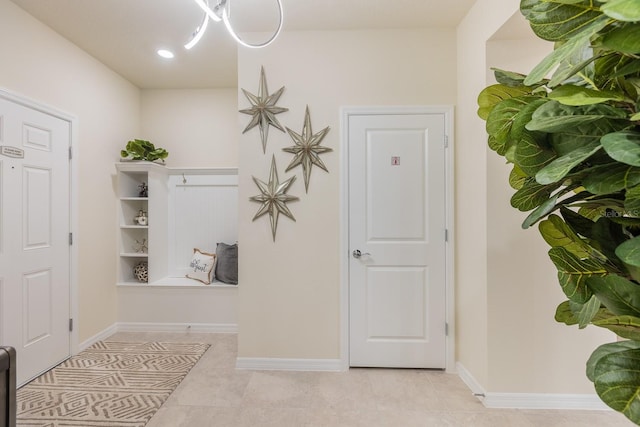 mudroom with light tile patterned floors