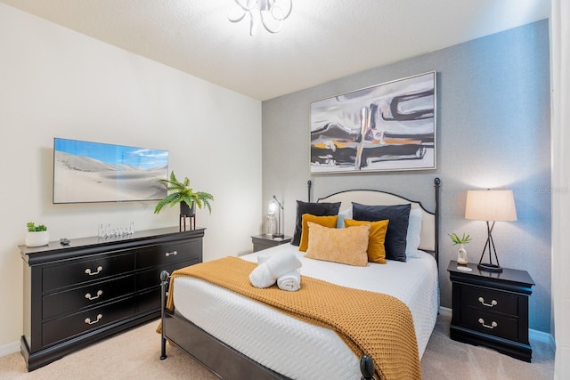 bedroom featuring light carpet