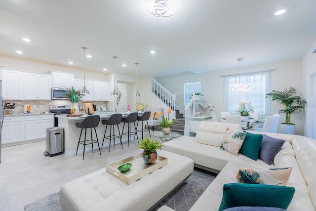 living room featuring a chandelier