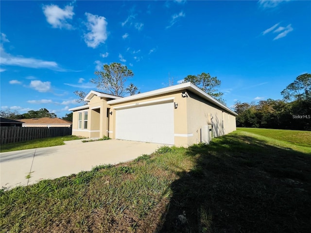 view of property exterior featuring a yard and a garage