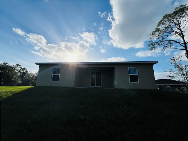 rear view of house with a yard