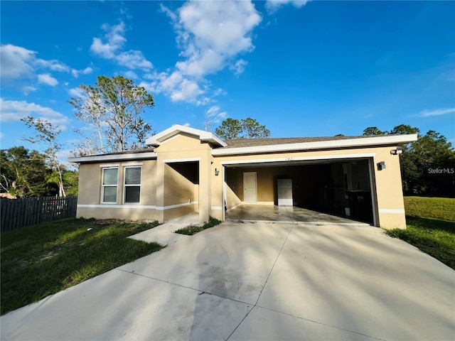 view of front of property featuring a garage and a front yard