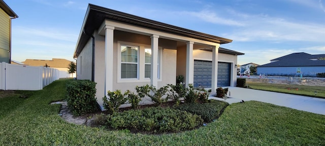 exterior space with a front yard and a garage