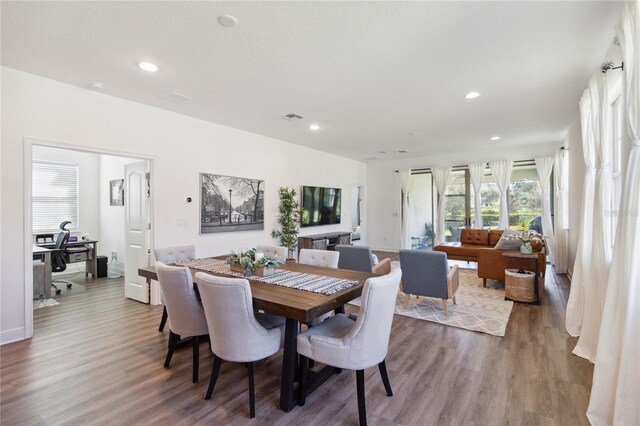 dining room with wood-type flooring