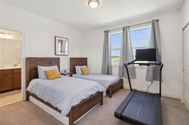 carpeted bedroom featuring connected bathroom