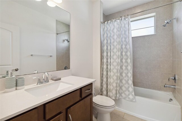 full bathroom featuring vanity, tile patterned flooring, shower / bathtub combination with curtain, and toilet